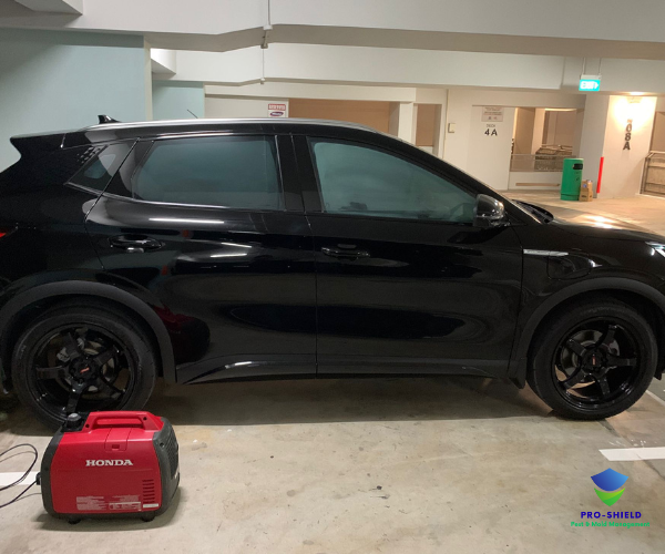 Pro-Shield equipment setup — Honda generator powering the ULV fogger in an HDB carpark